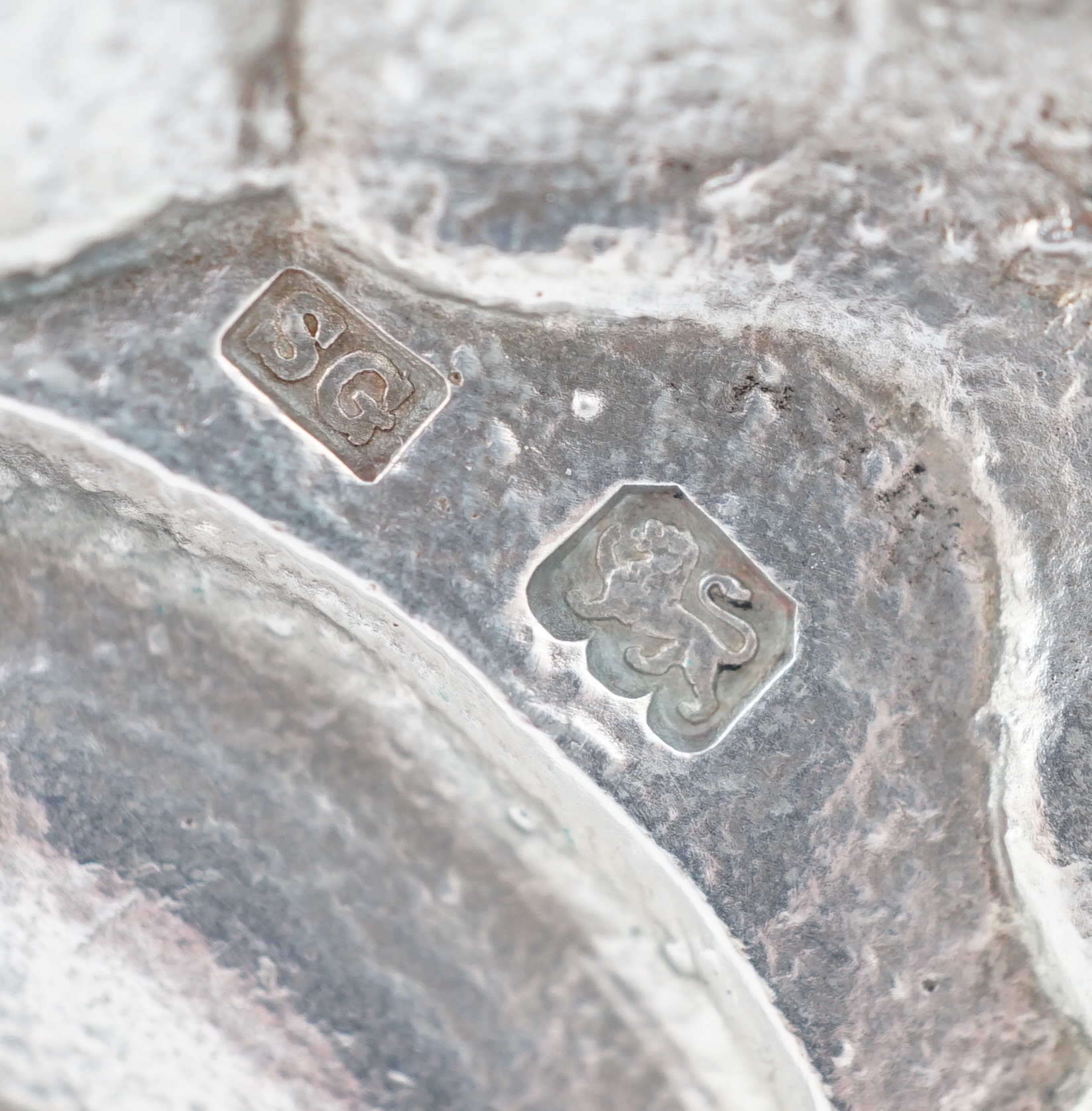 A pair of George V silver tapersticks by Sebastian Garrard for Garrards